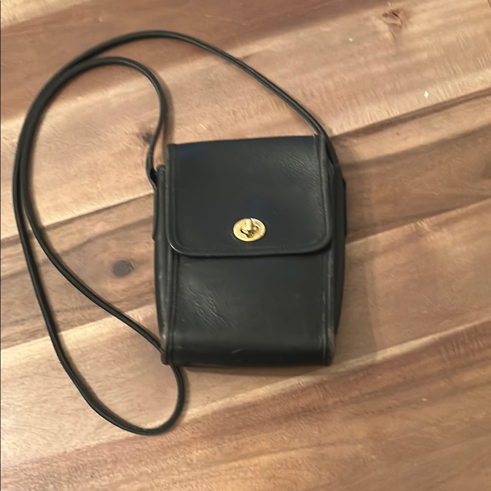 Elegant Coach Black Leather Bag with Gold Accent